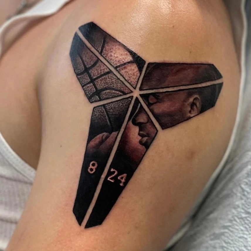 Basketball tripod portrait with date tattoo done in black and grey fine line ink work by tattoo artist Russ Howie of Sacred Mandala Studio in Durham, NC.